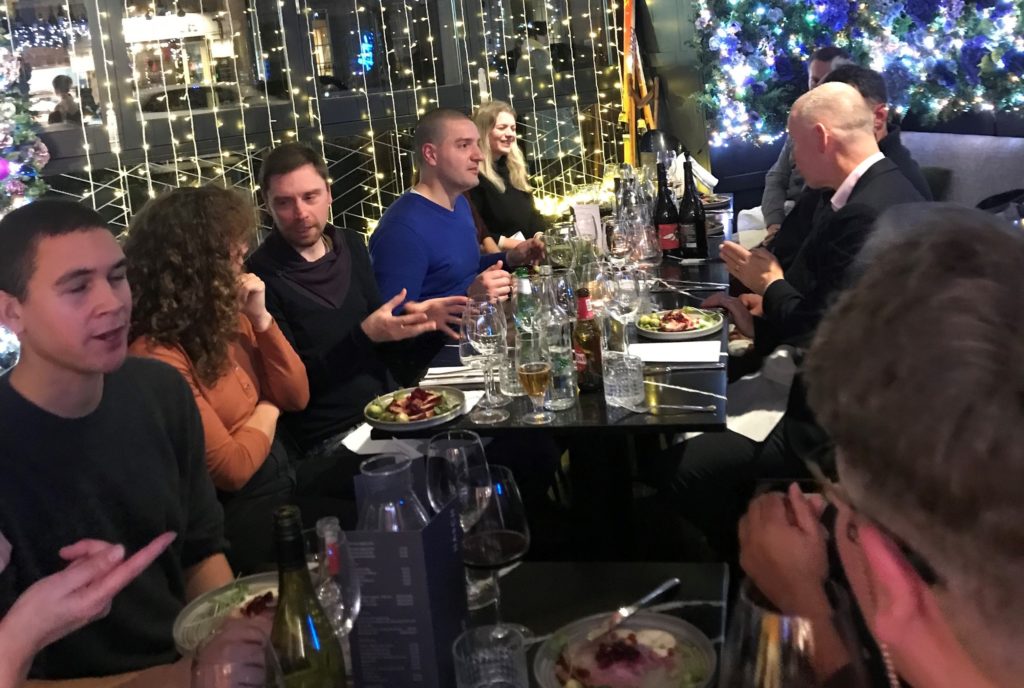 Group of people enjoying a meal